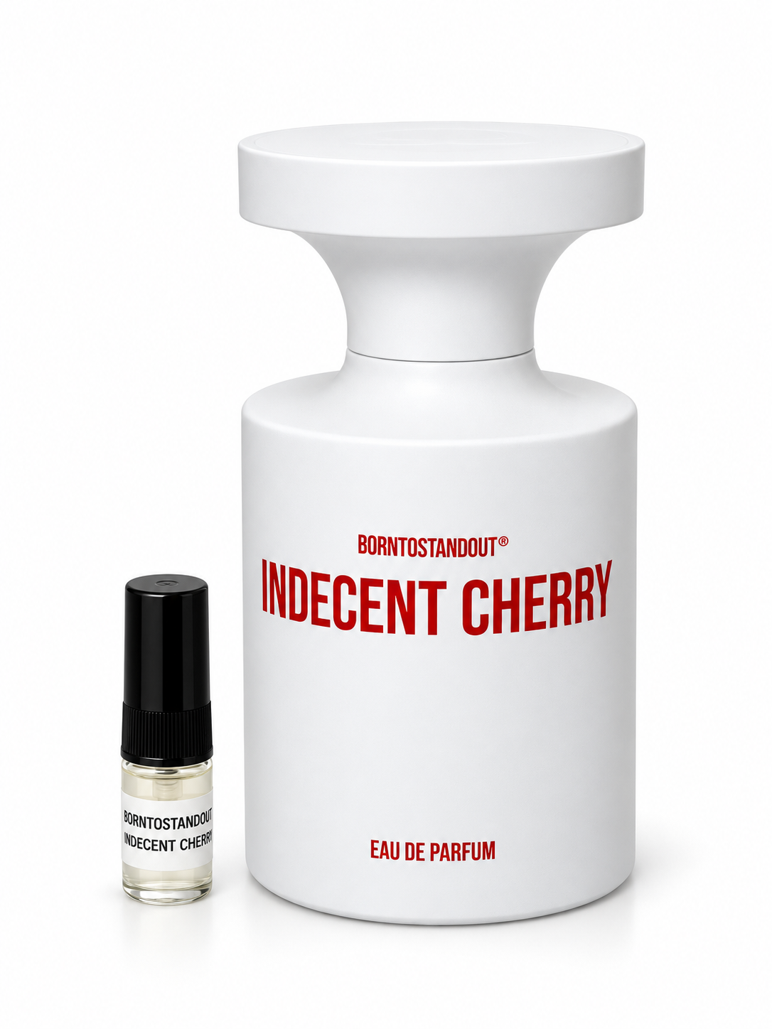 Born To Stand Out Indecent Cherry fragrance bottle and black-capped sample vial on white