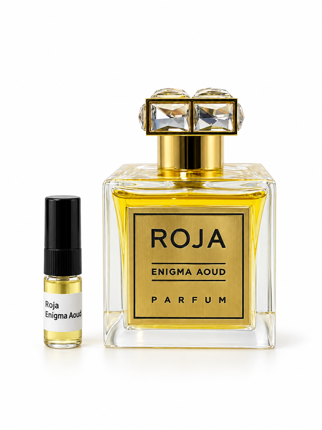 Roja Enigma Aoud fragrance bottle and black-capped sample vial on white