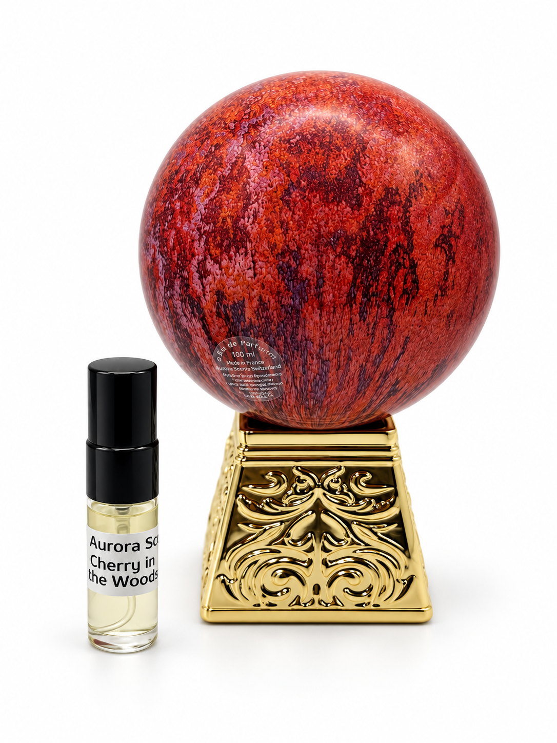 Aurora Scents Cherry in the woods fragrance bottle and black-capped sample vial on white