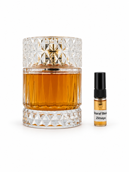 Zimaya Sharaf Blend fragrance bottle and black-capped sample vial on white