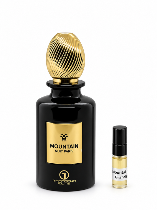 Grandeur Mountain Nuit Paris fragrance bottle and black-capped sample vial on white