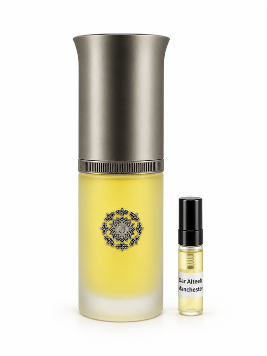 Dar Alteeb Manchester fragrance bottle and black-capped sample vial on white