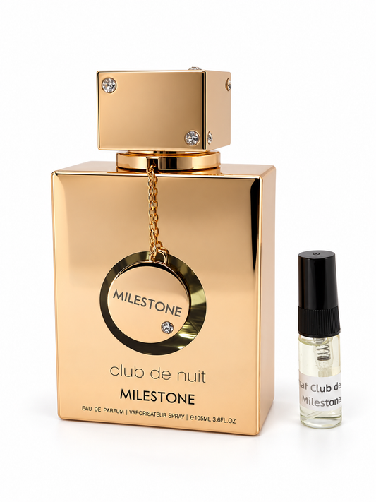 Armaf Club De Nuit Milestone fragrance bottle and black-capped sample vial on white