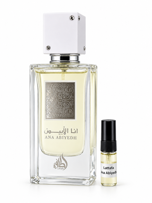 Lattafa Ana Abiyedh fragrance bottle and black-capped sample vial on white