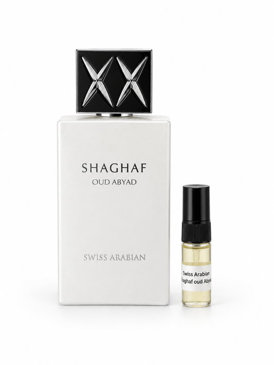 Swiss Arabian Shaghaf Oud Abyad fragrance bottle and black-capped sample vial on white