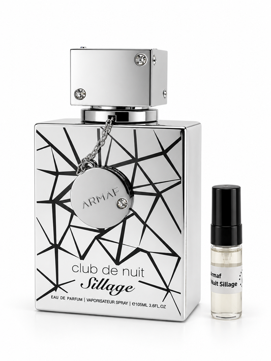 Armaf Club De Nuit Sillage fragrance bottle and black-capped sample vial on white