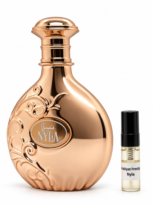 Arabiyat Nyla fragrance bottle and black-capped sample vial on white