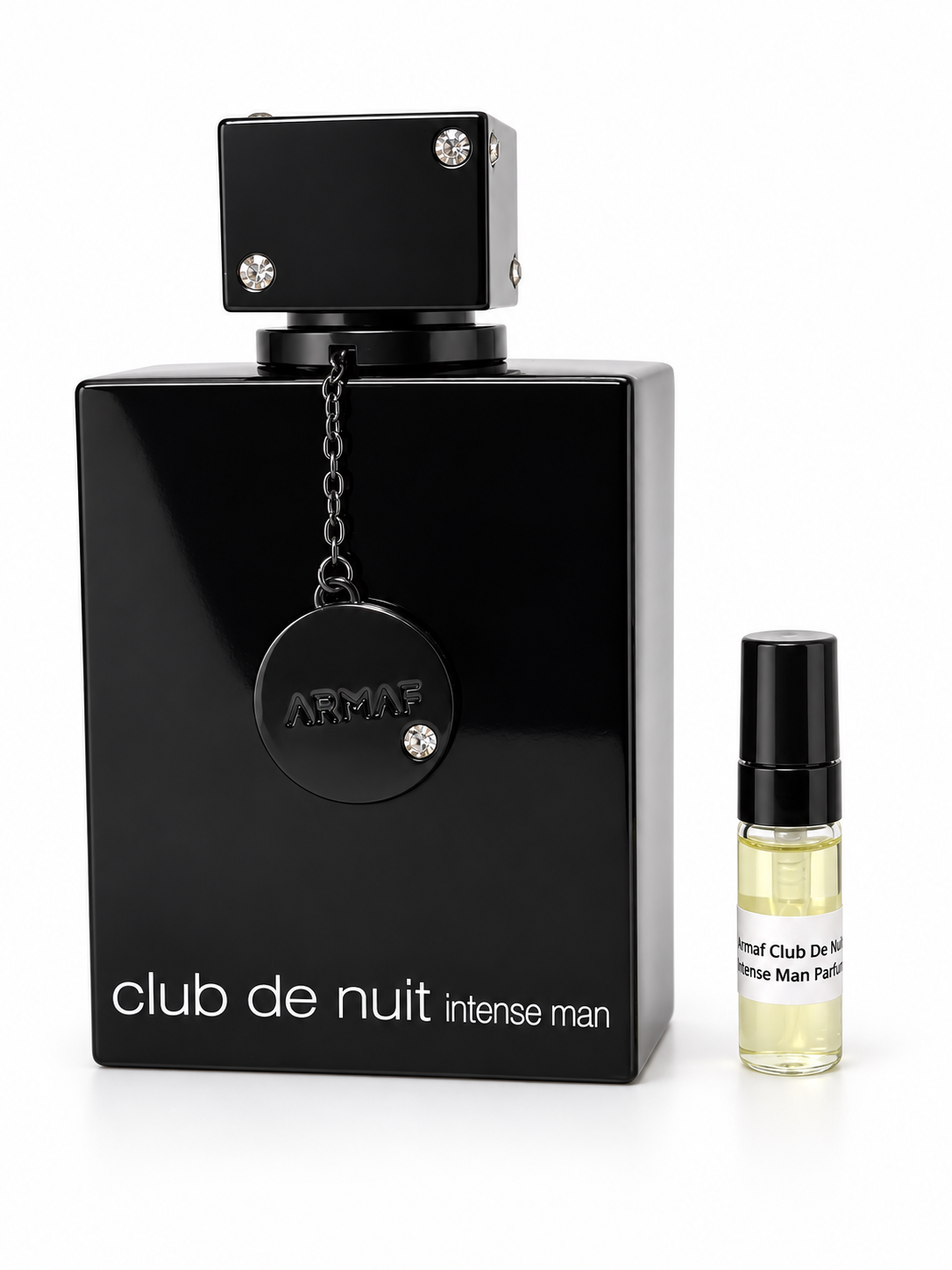 Armaf Club De Nuit Intense Man Parfum fragrance bottle and black-capped sample vial on white