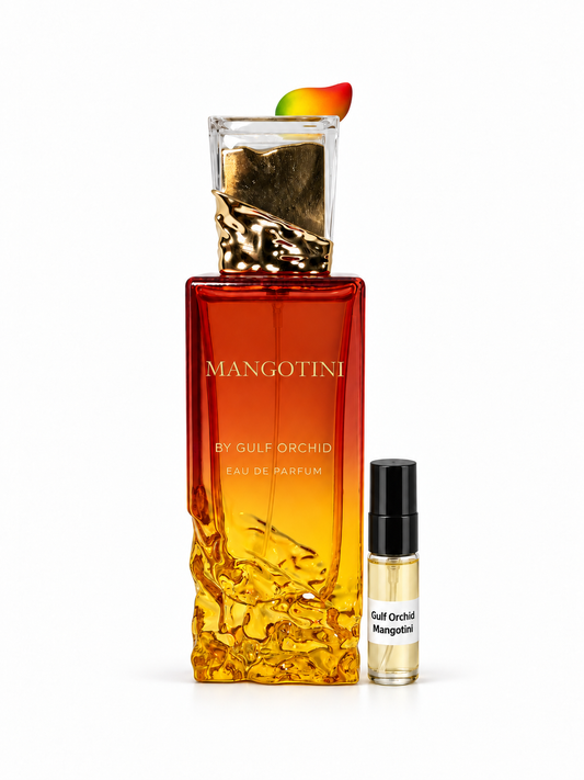 Gulf Orchid Mangotini fragrance bottle and black-capped sample vial on white