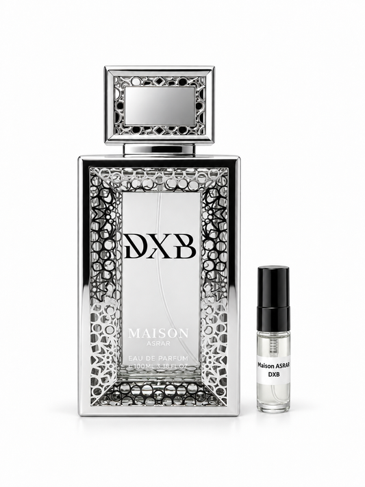 Maison Asrar DXB fragrance bottle and black-capped sample vial on white