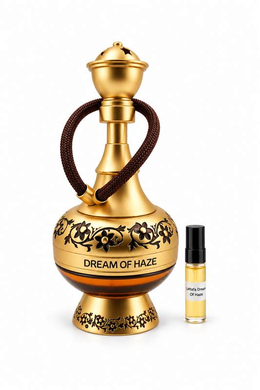 Lattafa Dream Of Haze fragrance bottle and black-capped sample vial on white
