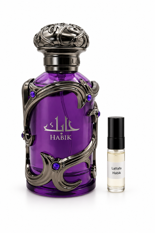 Lattafa Habik For Men fragrance bottle and black-capped sample vial on white
