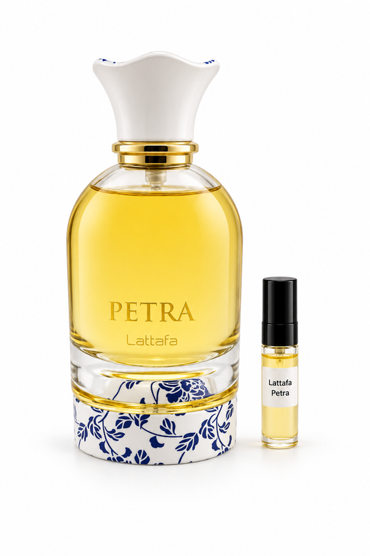 Lattafa Petra fragrance bottle and black-capped sample vial on white