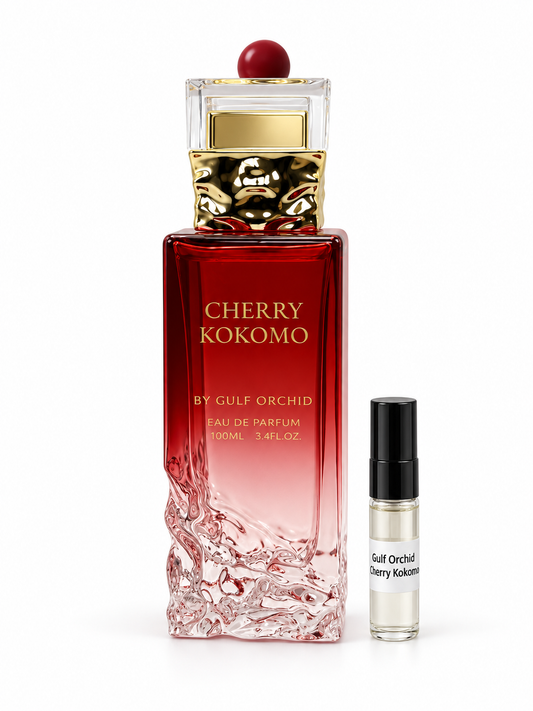 Gulf Orchid Cherry Kokomo fragrance bottle and black-capped sample vial on white