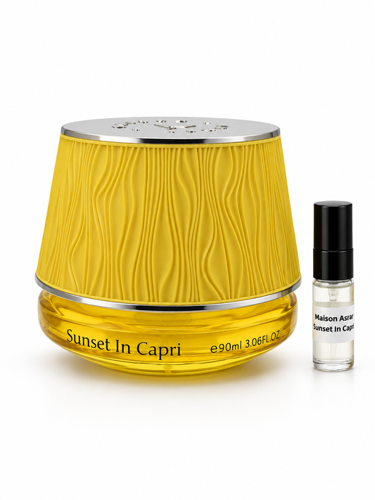 Maison Asrar Sunset In Capri fragrance bottle and black-capped sample vial on white
