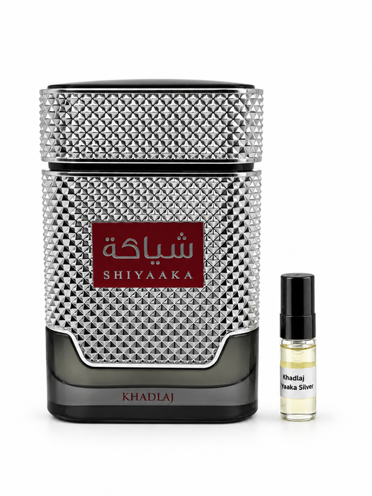 Khadlaj Shiyaaka Silver fragrance bottle and black-capped sample vial on white