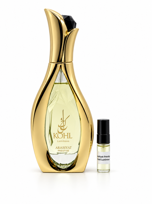 Arabiyat Prestige Kohl Luminous fragrance bottle and black-capped sample vial on white
