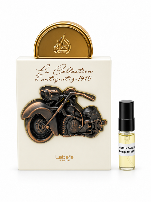 Lattafa Pride La Collection D'antique 1910 fragrance bottle and black-capped sample vial on white