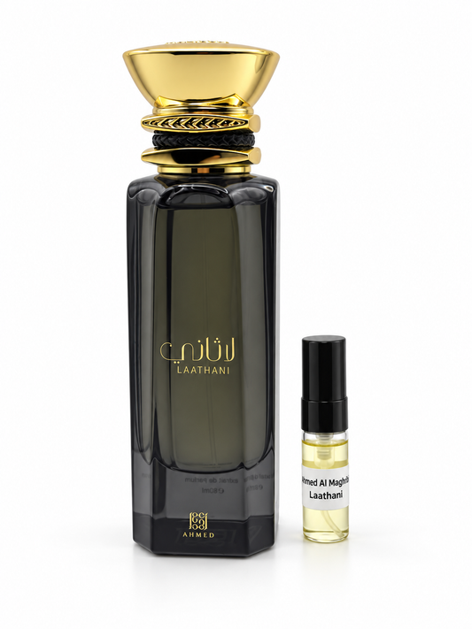 Ahmed Al Maghribi Laathani fragrance bottle and black-capped sample vial on white