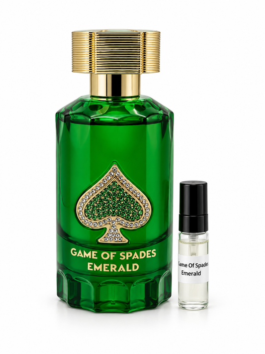 Game Of Spades Emerald fragrance bottle and black-capped sample vial on white
