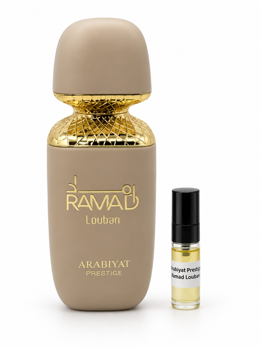 Arabiyat Prestige Ramad Louban fragrance bottle and black-capped sample vial on white