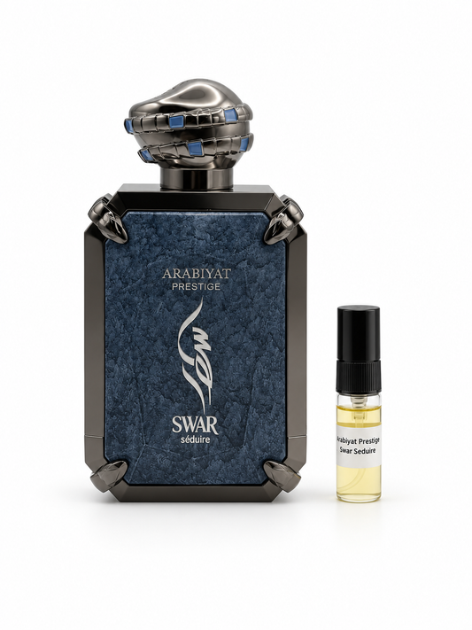 Arabiyat Prestige Swar Seduire fragrance bottle and black-capped sample vial on white