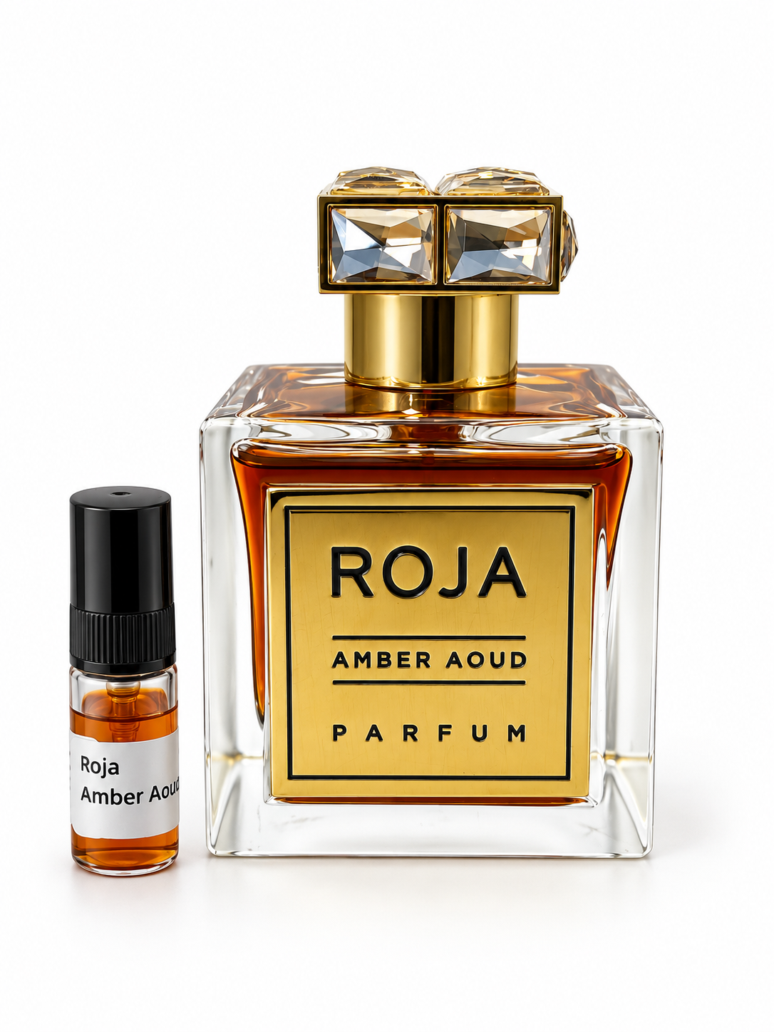 Roja Amber Aoud fragrance bottle and black-capped sample vial on white