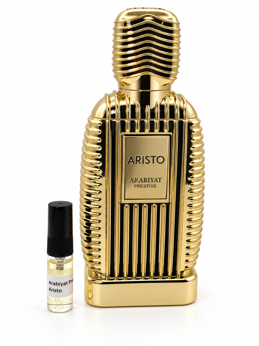 Arabiyat Prestige Aristo fragrance bottle and black-capped sample vial on white