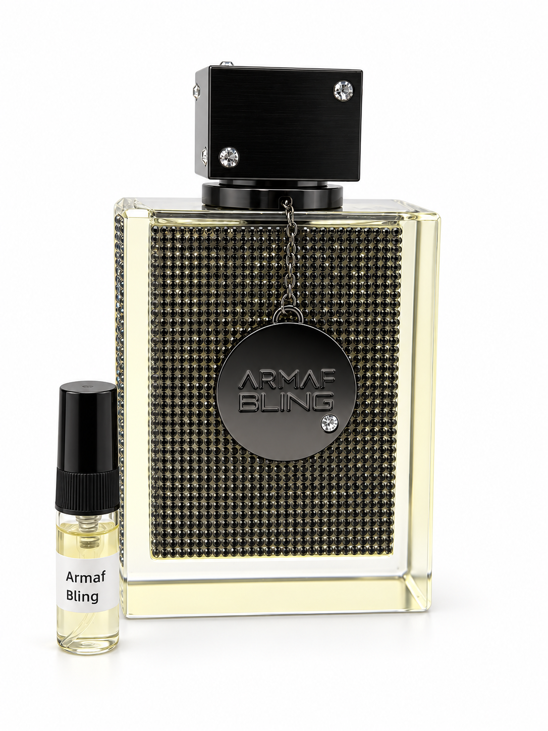 Armaf Club De Nuit Bling fragrance bottle and black-capped sample vial on white
