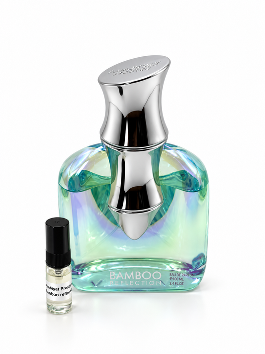 Arabiyat Prestige Bamboo Reflection fragrance bottle and black-capped sample vial on white