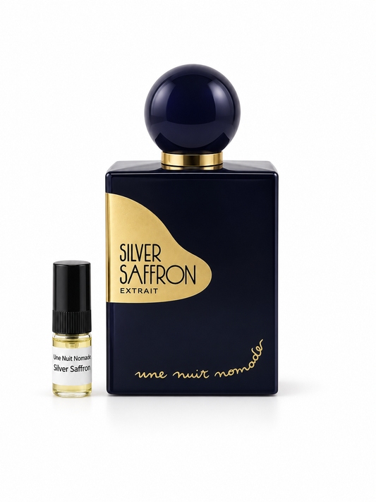 Une Nuit Nomade Silver Saffron fragrance bottle and black-capped sample vial on white
