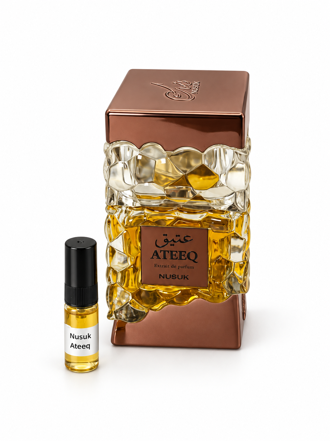 Nusuk Ateeq fragrance bottle and black-capped sample vial on white