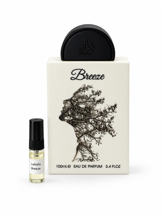 Lattafa Breeze fragrance bottle and black-capped sample vial on white
