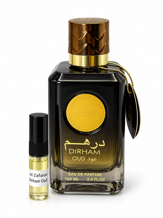 Dirham Oud Ard Al Zafaran fragrance bottle and black-capped sample vial on white