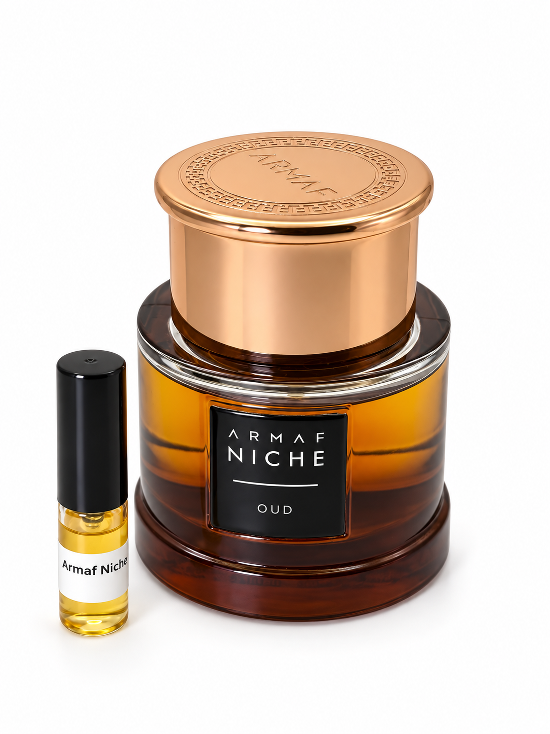 Armaf Niche Oud fragrance bottle and black-capped sample vial on white