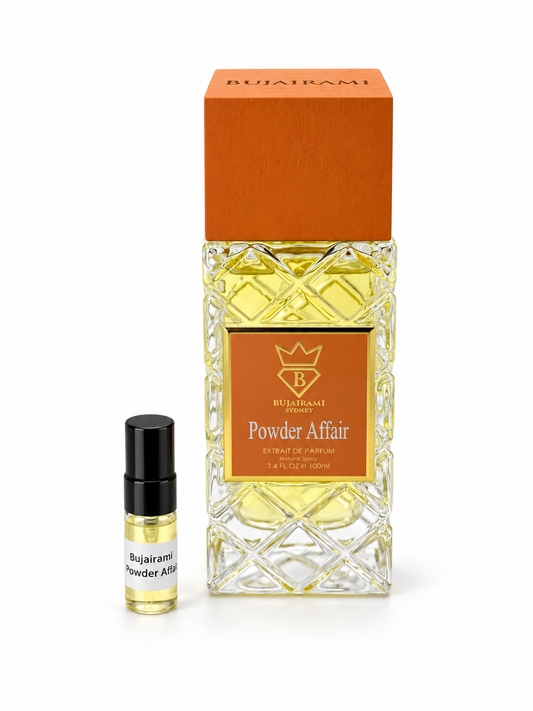 Bujairami Powder Affair fragrance bottle and black-capped sample vial on white