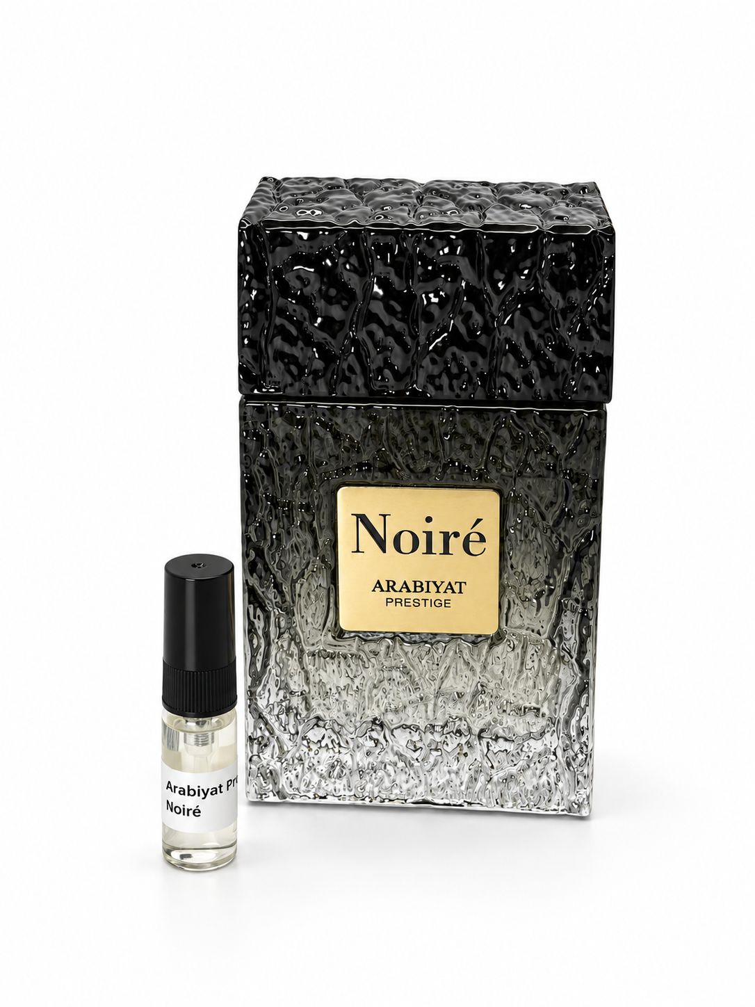 Arabiyat Prestige Noiré fragrance bottle and black-capped sample vial on white