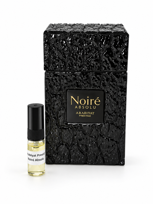 Arabiyat Prestige Noiré Absolu fragrance bottle and black-capped sample vial on white