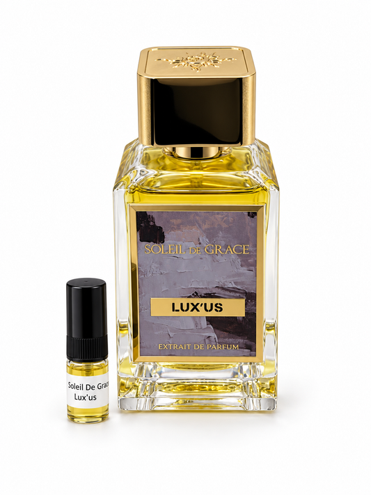 Soleil De Grace Lux'us fragrance bottle and black-capped sample vial on white