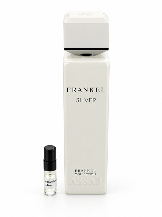 Assaf Frankel Silver fragrance bottle and black-capped sample vial on white