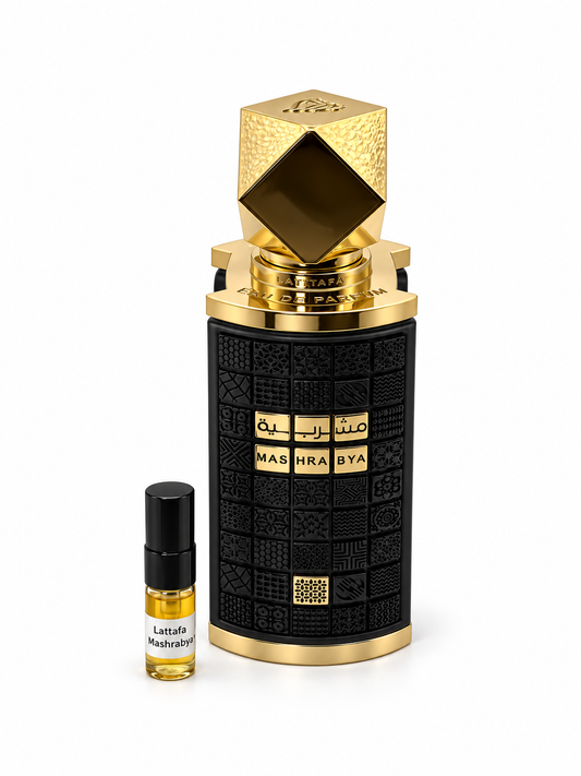 Lattafa Mashrabya fragrance bottle and black-capped sample vial on white