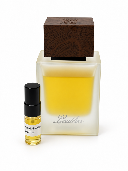 Ahmed Al Maghribi Leather fragrance bottle and black-capped sample vial on white