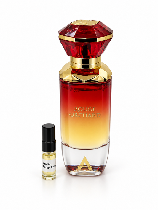Atralia Rouge Orchard fragrance bottle and black-capped sample vial on white