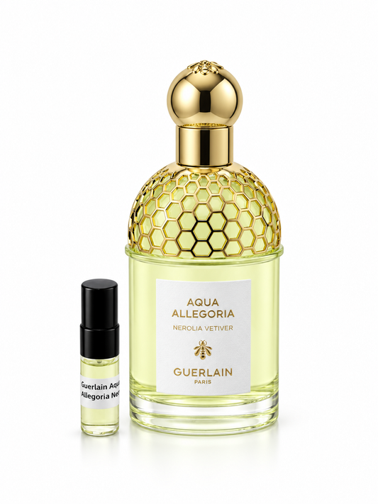 Guerlain Nerolia Vetiver fragrance bottle and black-capped sample vial on white