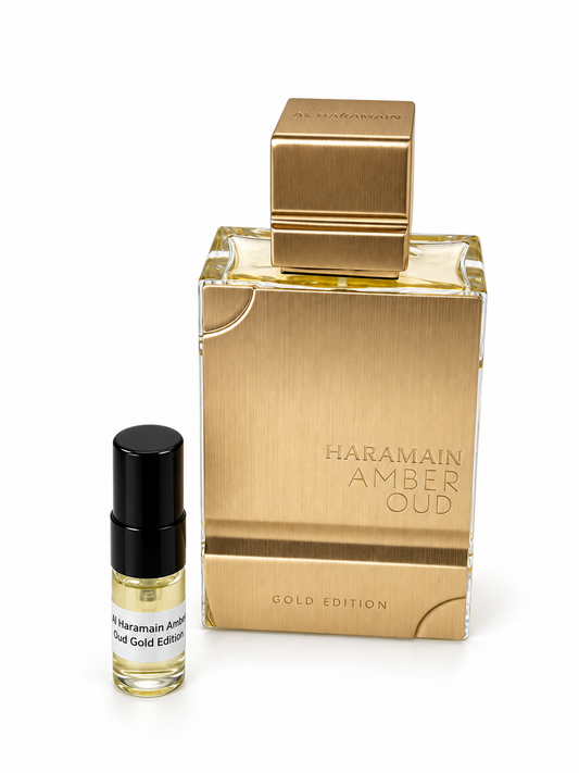 Al Haramain Amber Oud Gold Edition fragrance bottle and black-capped sample vial on white