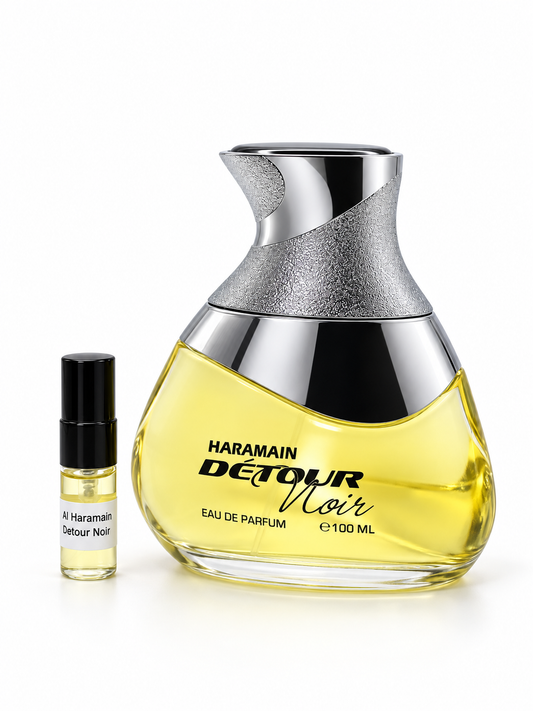 Al Haramain Detour Noir fragrance bottle and black-capped sample vial on white
