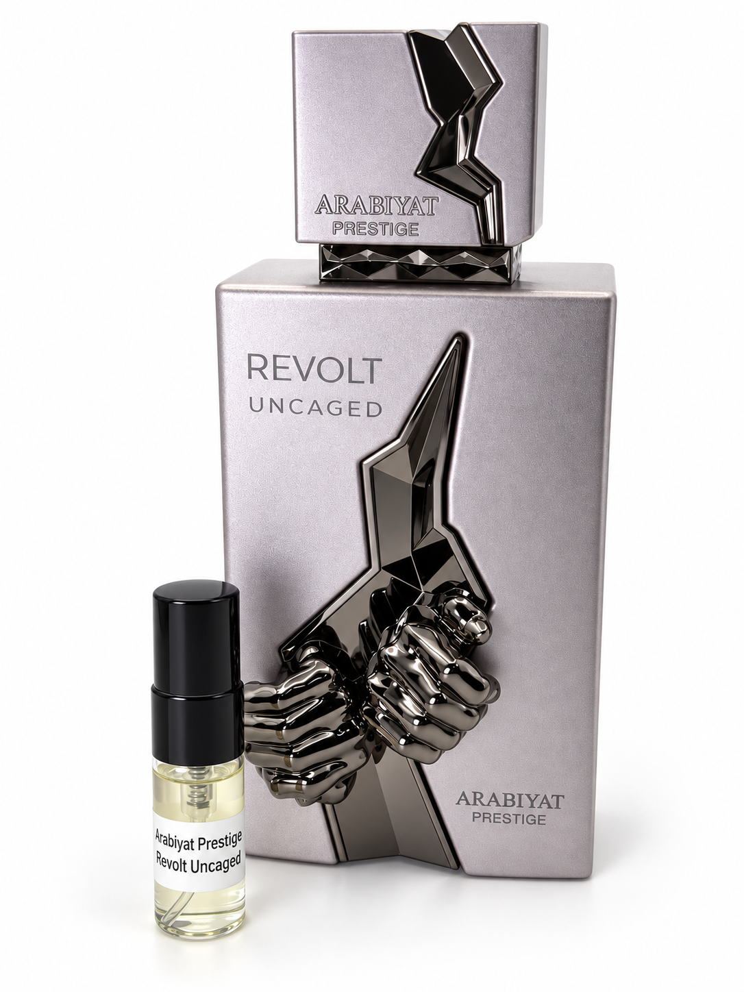 Arabiyat Prestige Revolt Uncaged fragrance bottle and black-capped sample vial on white