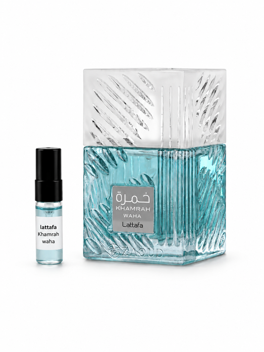 Lattafa Khamrah waha fragrance bottle and black-capped sample vial on white