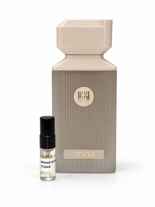 Ahmed Al Maghribi O'clock fragrance bottle and black-capped sample vial on white