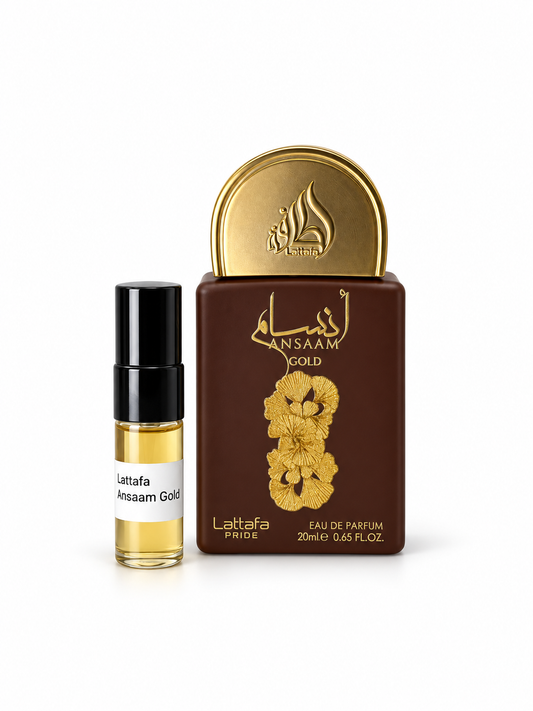 Lattafa Pride Ansaam Gold fragrance bottle and black-capped sample vial on white